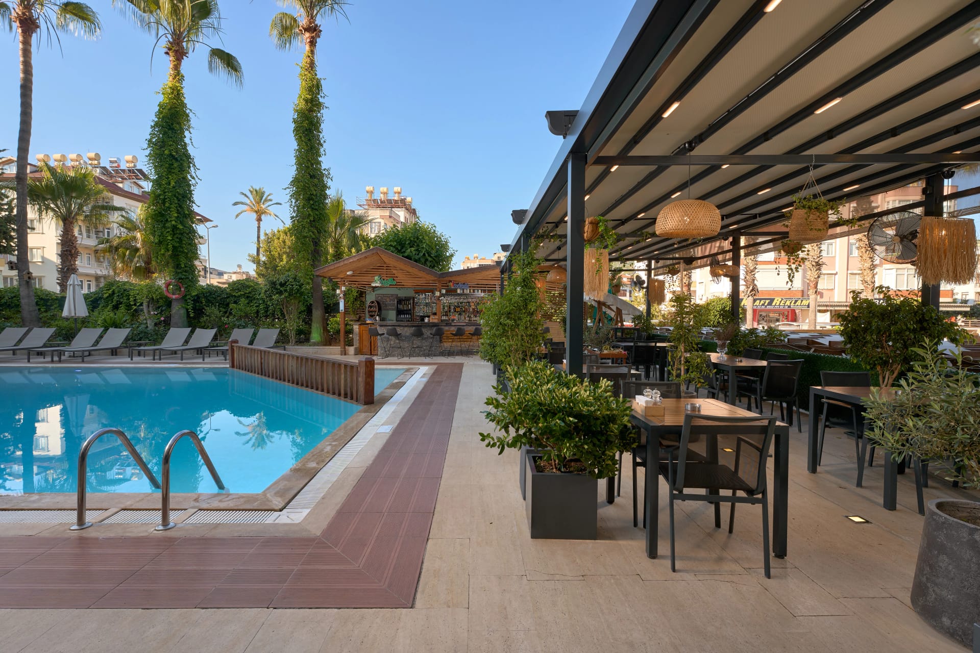 Pool terrace with sun loungers at Prince Alanya Apart Hotel